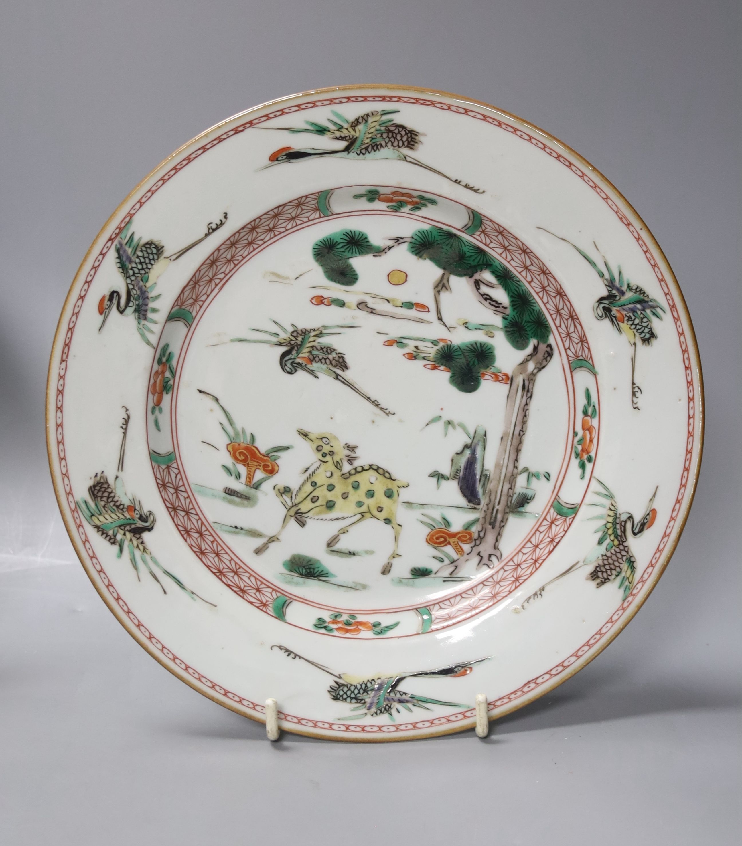 A Chinese Kangxi famille verte plate, decorated with a deer, a 19th century Chinese blue and white plate and an Imari scalloped dish, c.1850